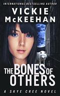 The Bones of Others by Vickie McKeehan
