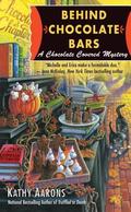 Behind Chocolate Bars (A Chocolate Covered Mystery #3) by Kathy Aarons
